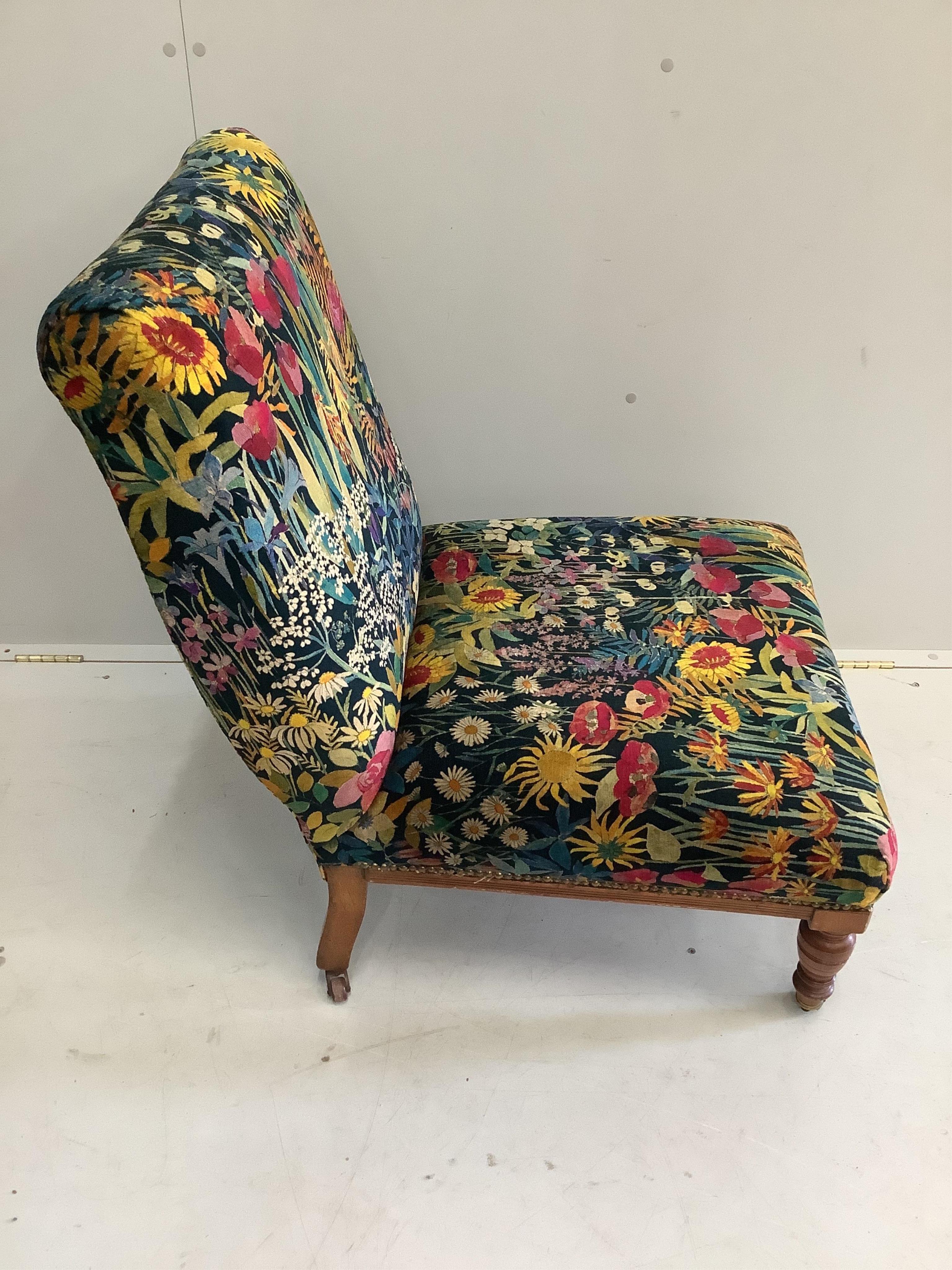 A 19th century mahogany nursing chair, upholstered in Liberty fabric, width 62cm, depth 66cm, height 86cm. Condition - good